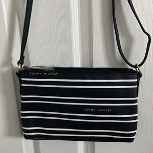 Brand new Tommy Hilfiger crossbody bag for women. Multiple pocket interior.